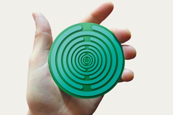 hero-fingertips-mobile2 Hand holding a Polaraid disc